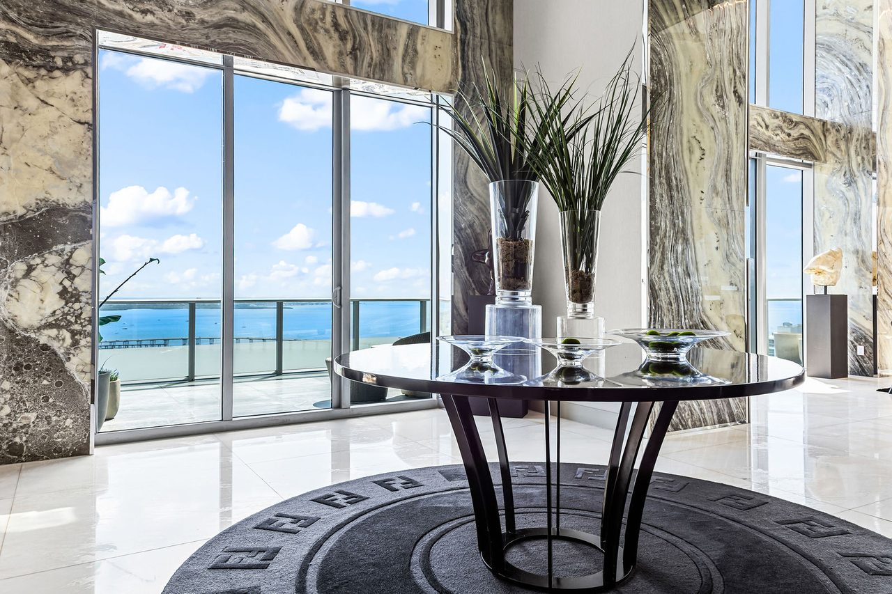 The arrival: the foyer, with the bay beyond the glass