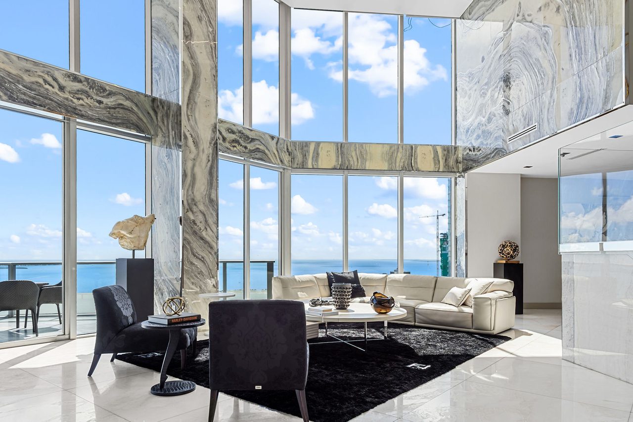 Stone-clad columns frame the bay in the main salon