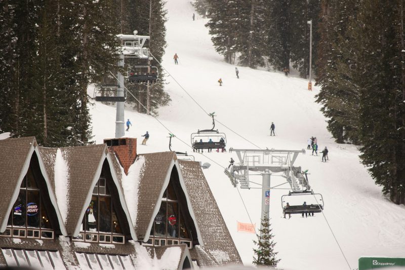 A chairlift and a mountain lodge at Deer Valley, Park City