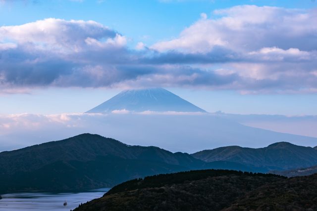 A private onsen at dawn with Fuji visible