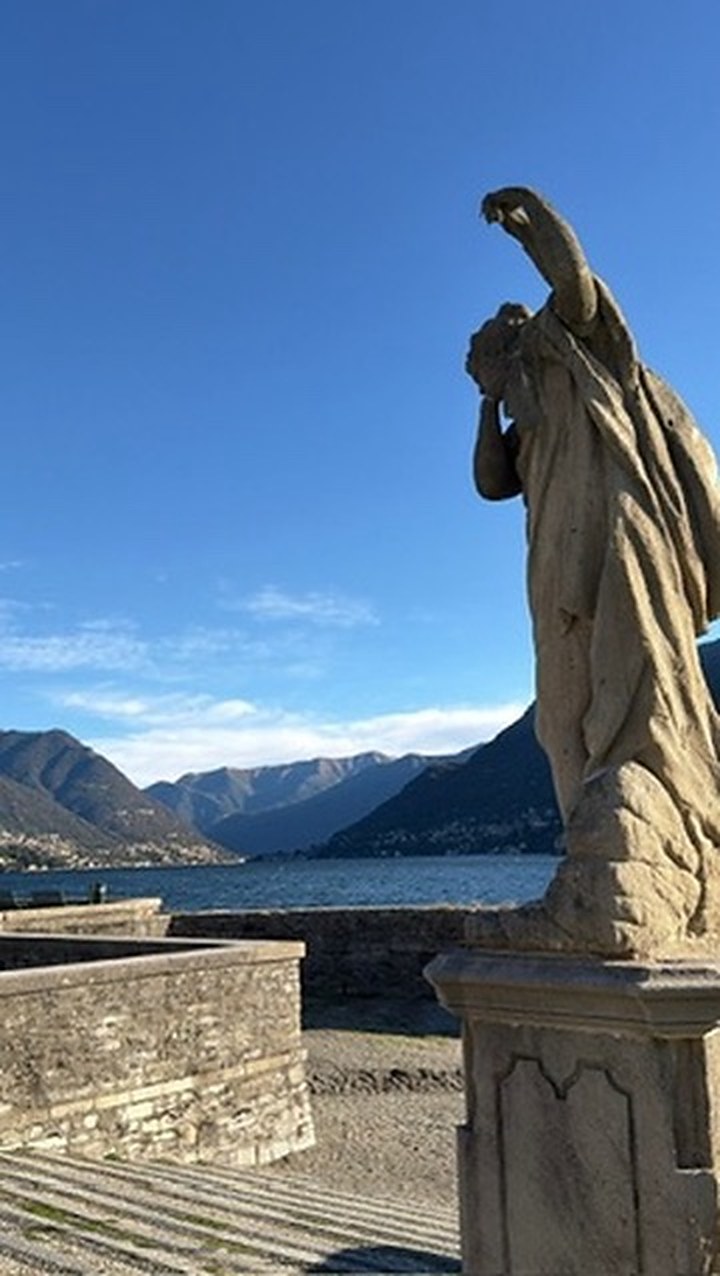 A statue on a terrace above Lake Como