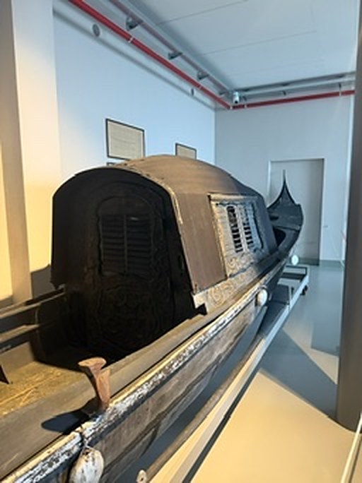 A historic boat on display in a museum